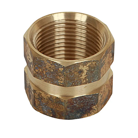 Brass threaded fitting on a white background