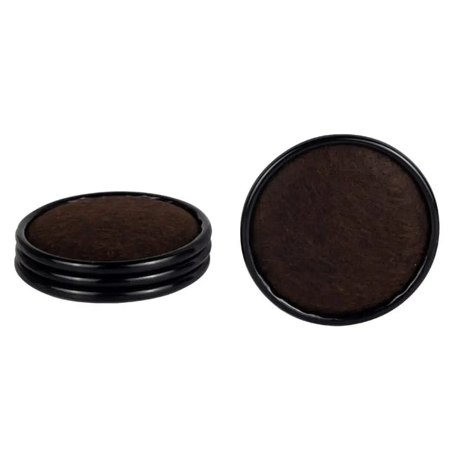 Two round dark brown objects with black rims on a white background