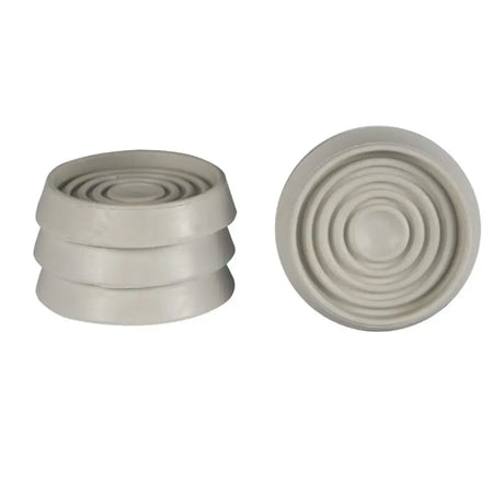 Two beige rubber seals with concentric circular patterns on a white background