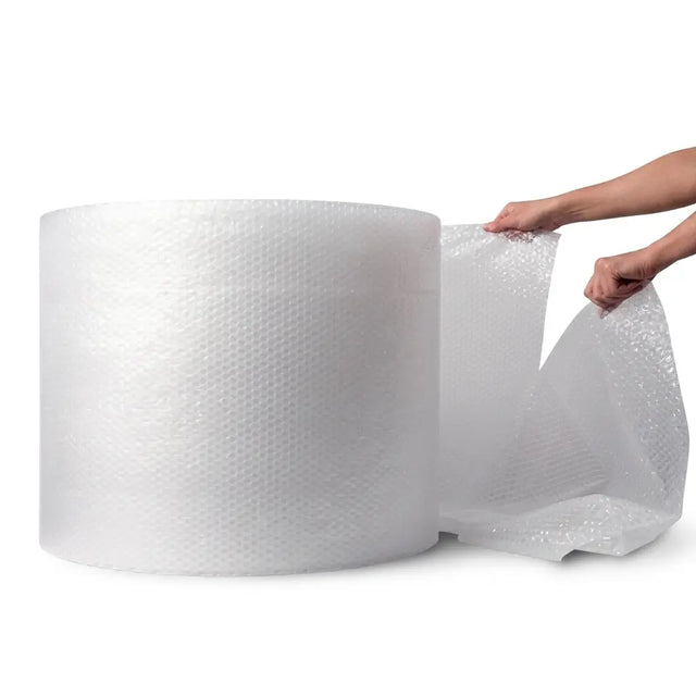 Roll of bubble wrap with a hand stretching it out on a white background