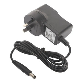 Black power adapter with plug and cable on a white background
