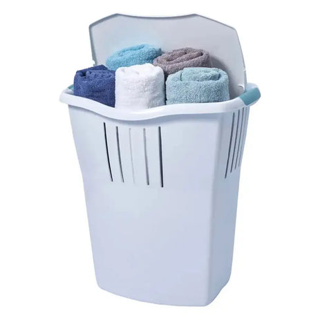 White laundry basket with rolled-up clothes on a white background