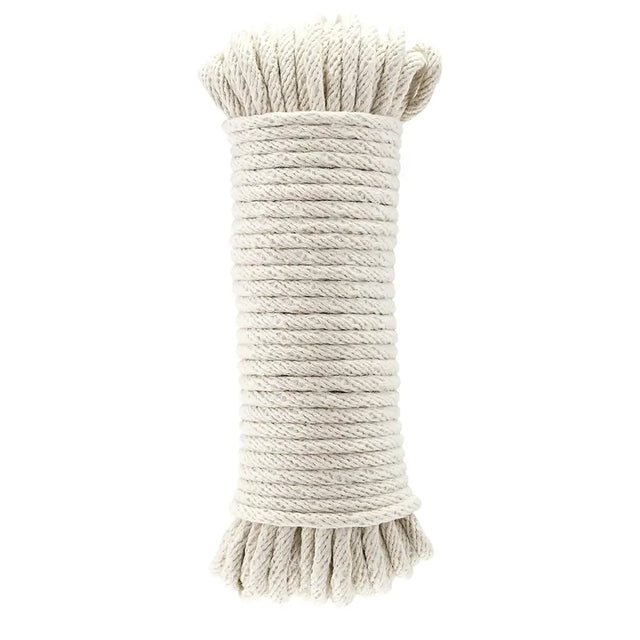 Coiled beige rope on a white background