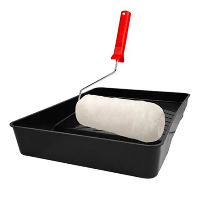 Paint roller with black tray and red handle on a white background