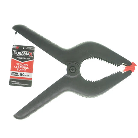 Black spring clamp with red accents and Duramax packaging on a white background