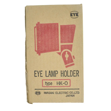 Cardboard box packaging for an eye lamp holder with red graphics and text on a white background.