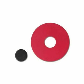 Red circular object with a central hole next to a smaller black circular object on a white background