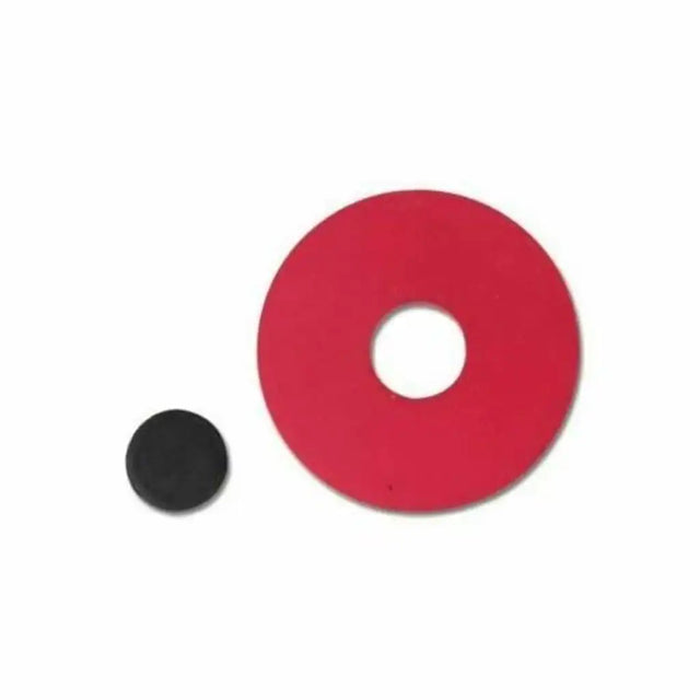 Red circular object with a central hole next to a smaller black circular object on a white background