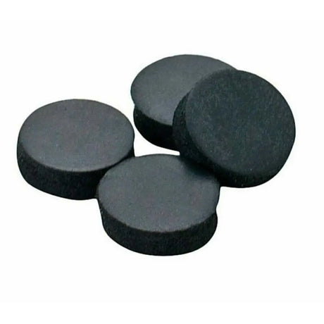 Four black round magnets on a white background