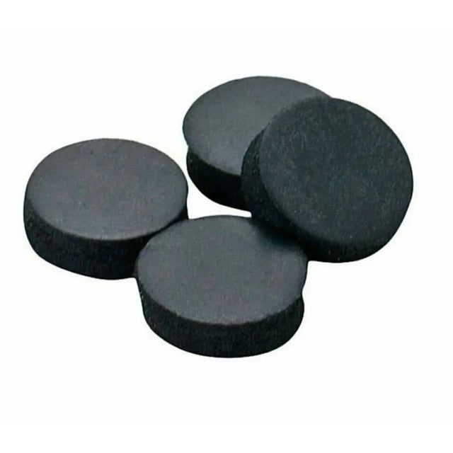 Four black round magnets on a white background