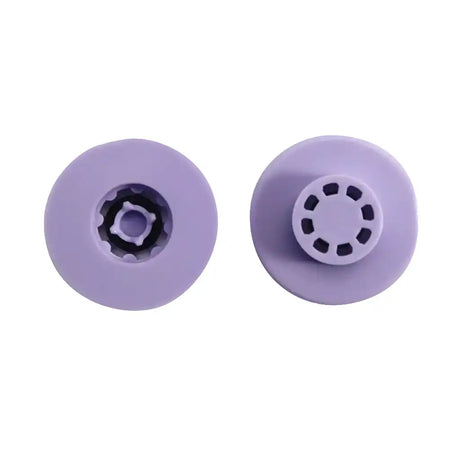 Two purple rubber washers with central holes on a white background
