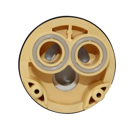 Mechanical component with beige casing and gray inner parts on a white background