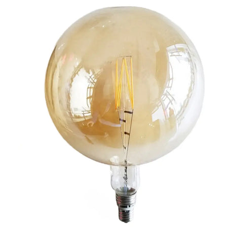 Vintage-style light bulb with a gold glass cover on a white background