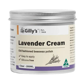 A 200ml jar of Gilly's Lavender Cream, an old-fashioned beeswax polish. The product is in a white plastic jar with a silver metal screw-on lid, featuring a cream-colored label with purple and orange accents, and a lavender flower illustration.