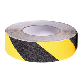 Roll of black and yellow striped safety tape on a white background