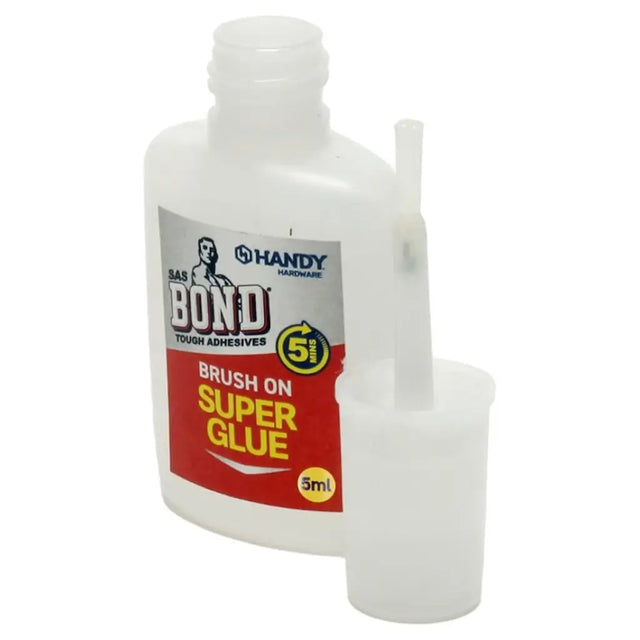Handy Bond brush on super glue bottle with label on a white background