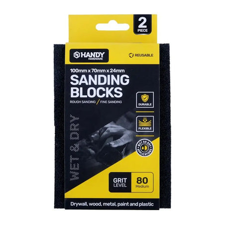 Pack of sanding blocks with yellow and black packaging on a white background