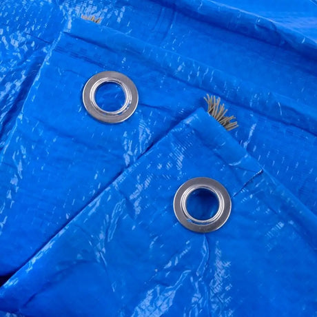 Close-up of blue tarpaulin with metal eyelets