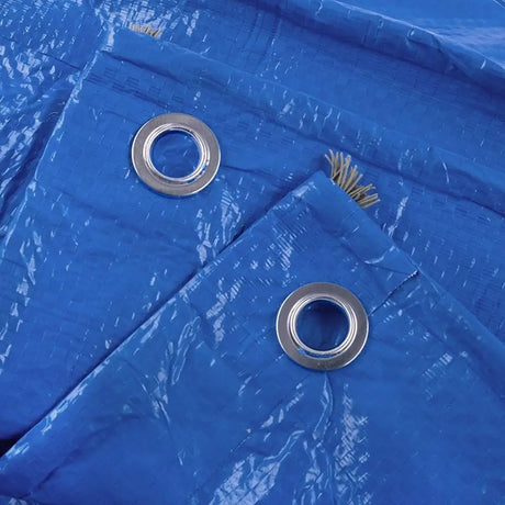 Close-up of a blue tarp with metal eyelets
