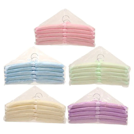 Set of folded baby blankets in various pastel colors on a white background