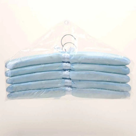 Set of light blue hangers on a white background