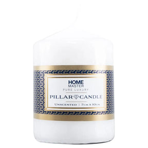 White pillar candle with a decorative label on a white background