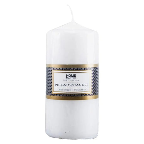 White pillar candle with a label on a white background