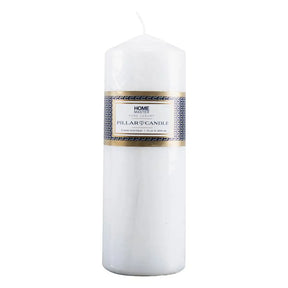 White pillar candle with a label on a white background