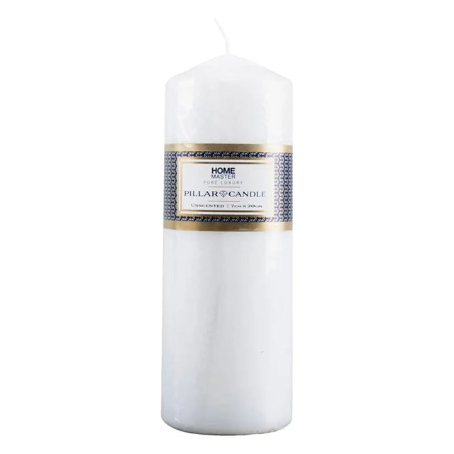 White pillar candle with a label on a white background