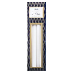 Two white tapered candles in a decorative box with 'Home Elements' branding on a white background.