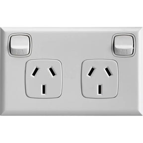 Silver electrical socket with two outlets and two switches on a white background