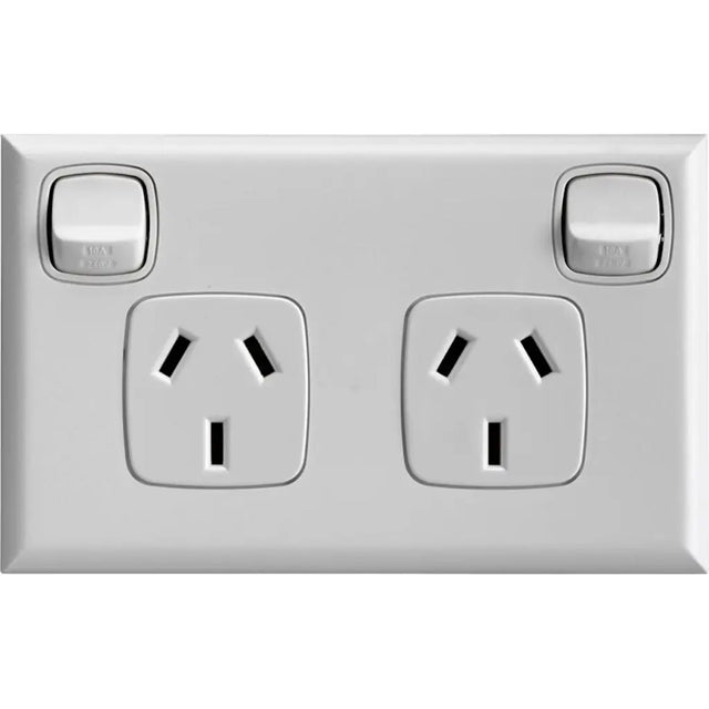 Silver electrical socket with two outlets and two switches on a white background