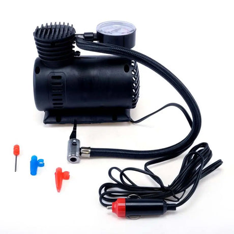 Black air compressor with attachments on a white background
