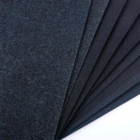 Stack of dark blue felt sheets on a white background
