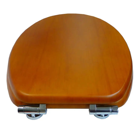 Wooden toilet seat with metal hinges on a white background