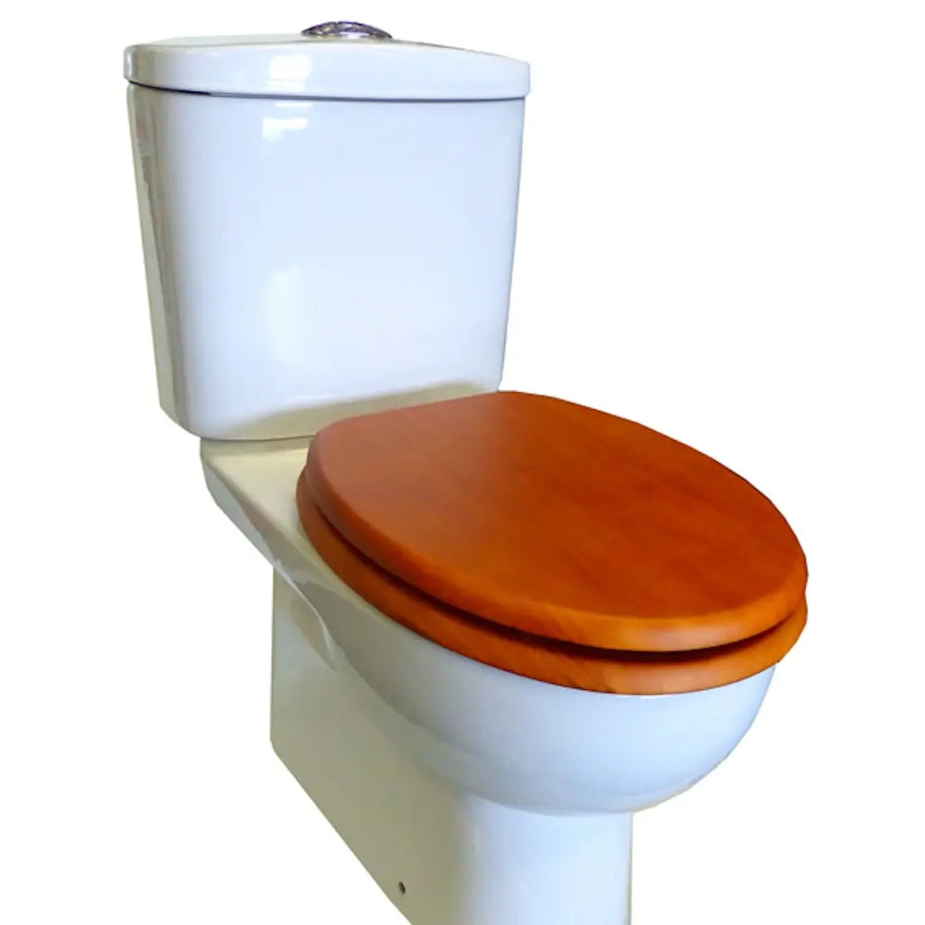 White toilet with a wooden seat on a white background
