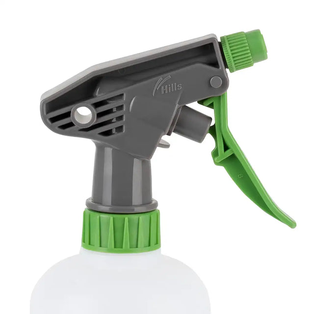 Spray bottle with green and gray nozzle on a white background