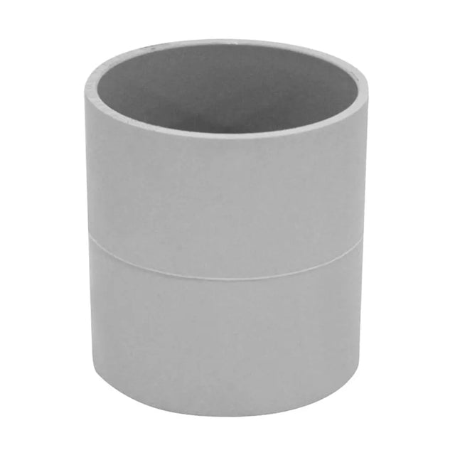 Gray cylindrical pvc coupling on a white background
