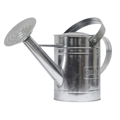 Metal watering can with 'holman' branding on a white background