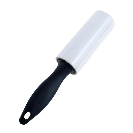 White lint roller with black handle on a white background