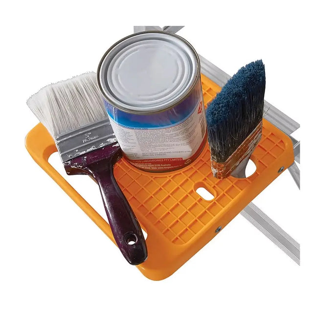 Orange paint tray with a can of paint and two brushes on a white background
