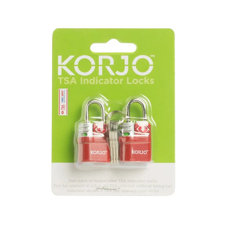 Two red TSA indicator locks in clear plastic on a green KORJO packaging background.
