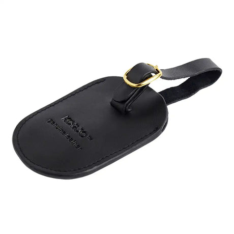 Black leather luggage tag with gold accent on a white background