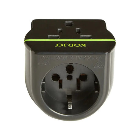 Black travel adapter with green accent on a white background