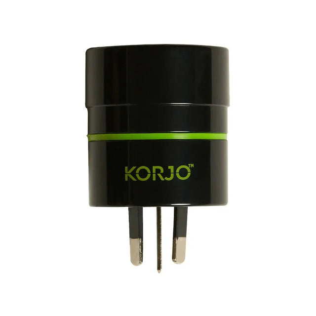 Black travel adapter with green accent and 'KORJO' branding on a white background