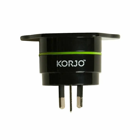 Black travel adapter with green accent and 'KORJO' branding on a white background