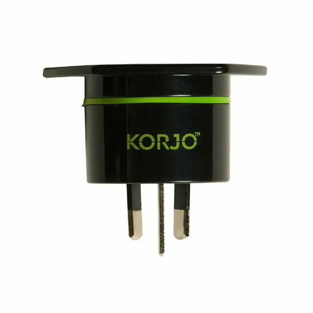 Black travel adapter with green accent and 'KORJO' branding on a white background