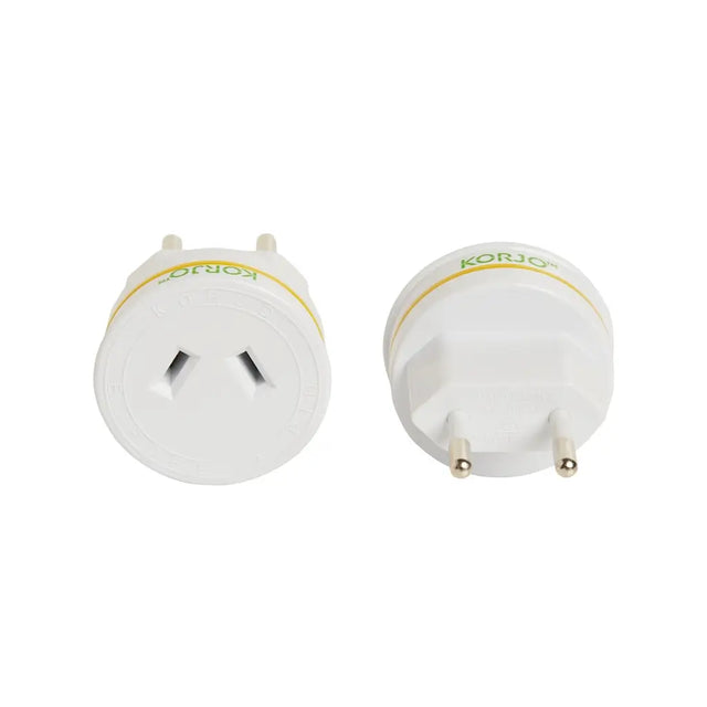Two white travel adapters with gold accents on a white background, branded 'Korjo'.