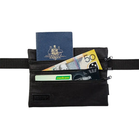 Black waist bag with passport, money, and cards on a white background