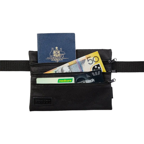 Black waist bag with passport, money, and cards on a white background